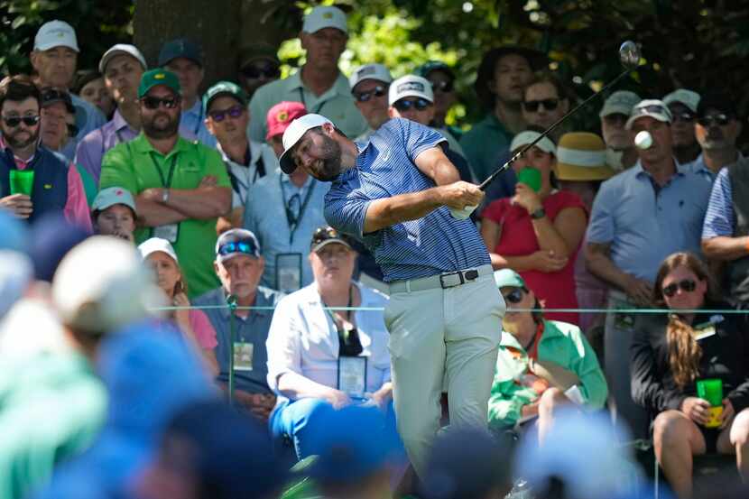 Scottie Scheffler hits his tee shot on the seventh hole during second round at the Masters...