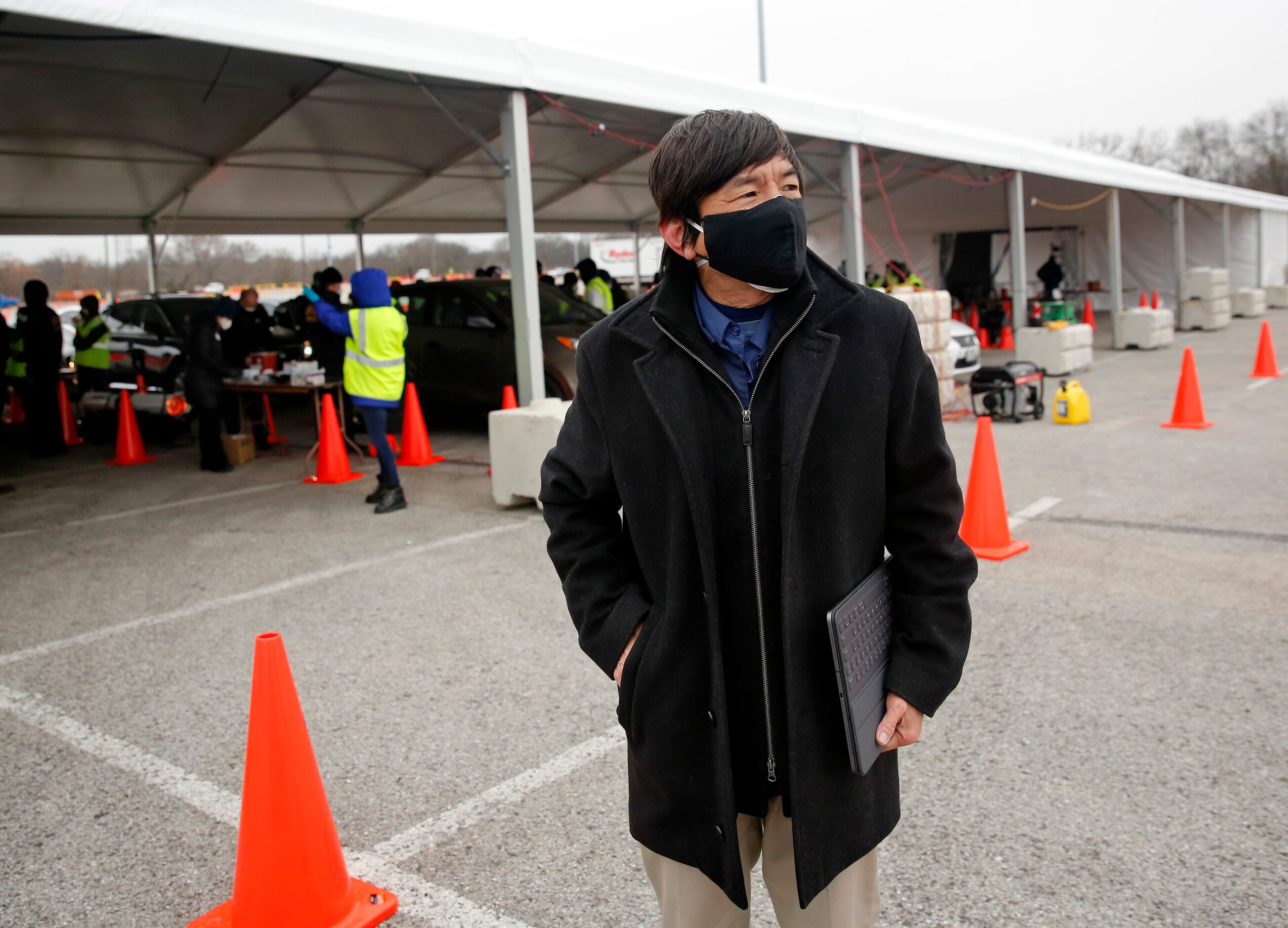 Dallas County Health and Human Services director Dr. Philip Huang checks on the  COVID-19...