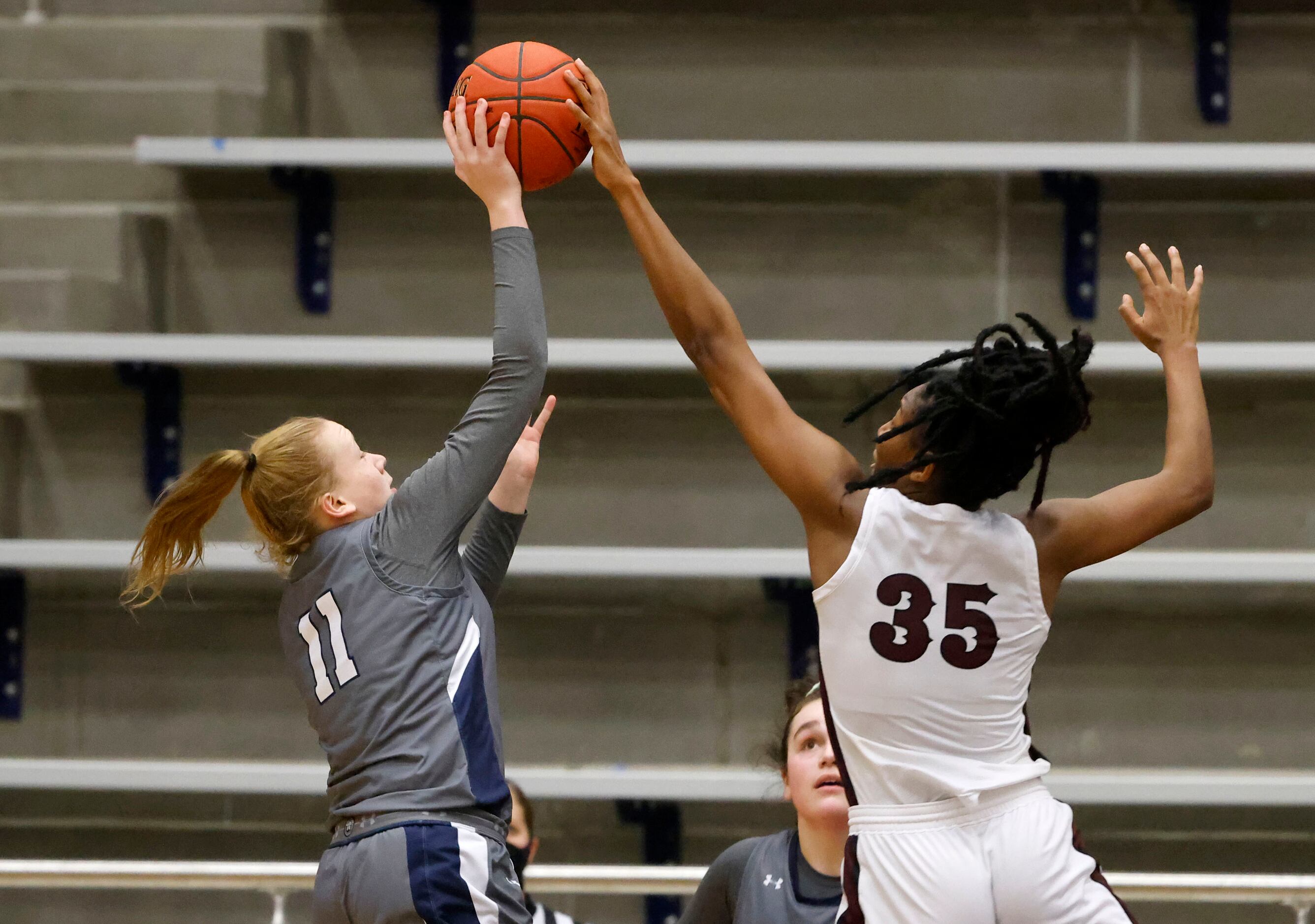 Red Oak’s  Aniyah Johnson (35) blocks a shot by Wylie East’s Kerbie Cash (11) during the...