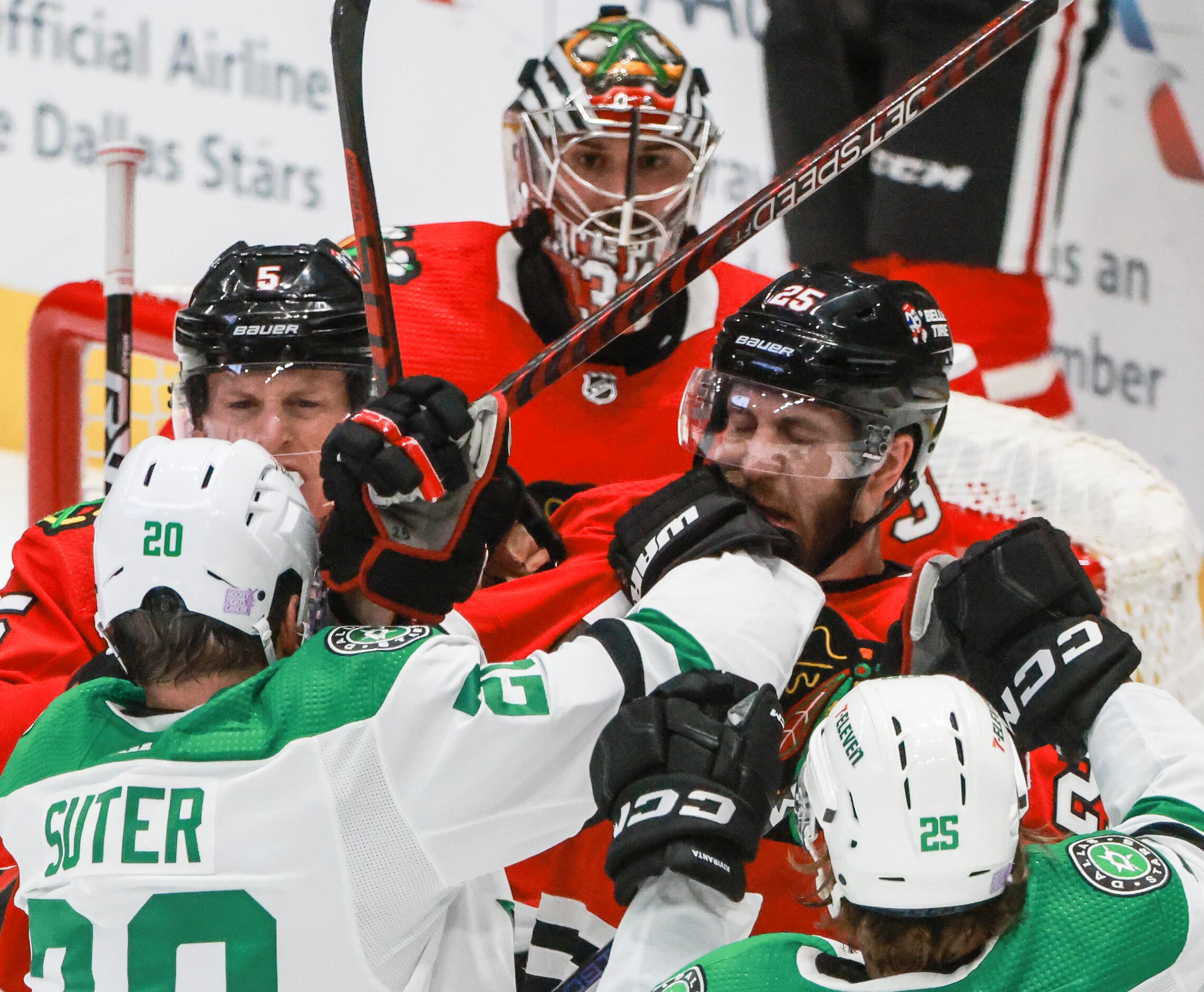 Dallas Stars defenseman Ryan Suter (20) jabs Chicago Blackhawks defenseman Jarred Tinordi...