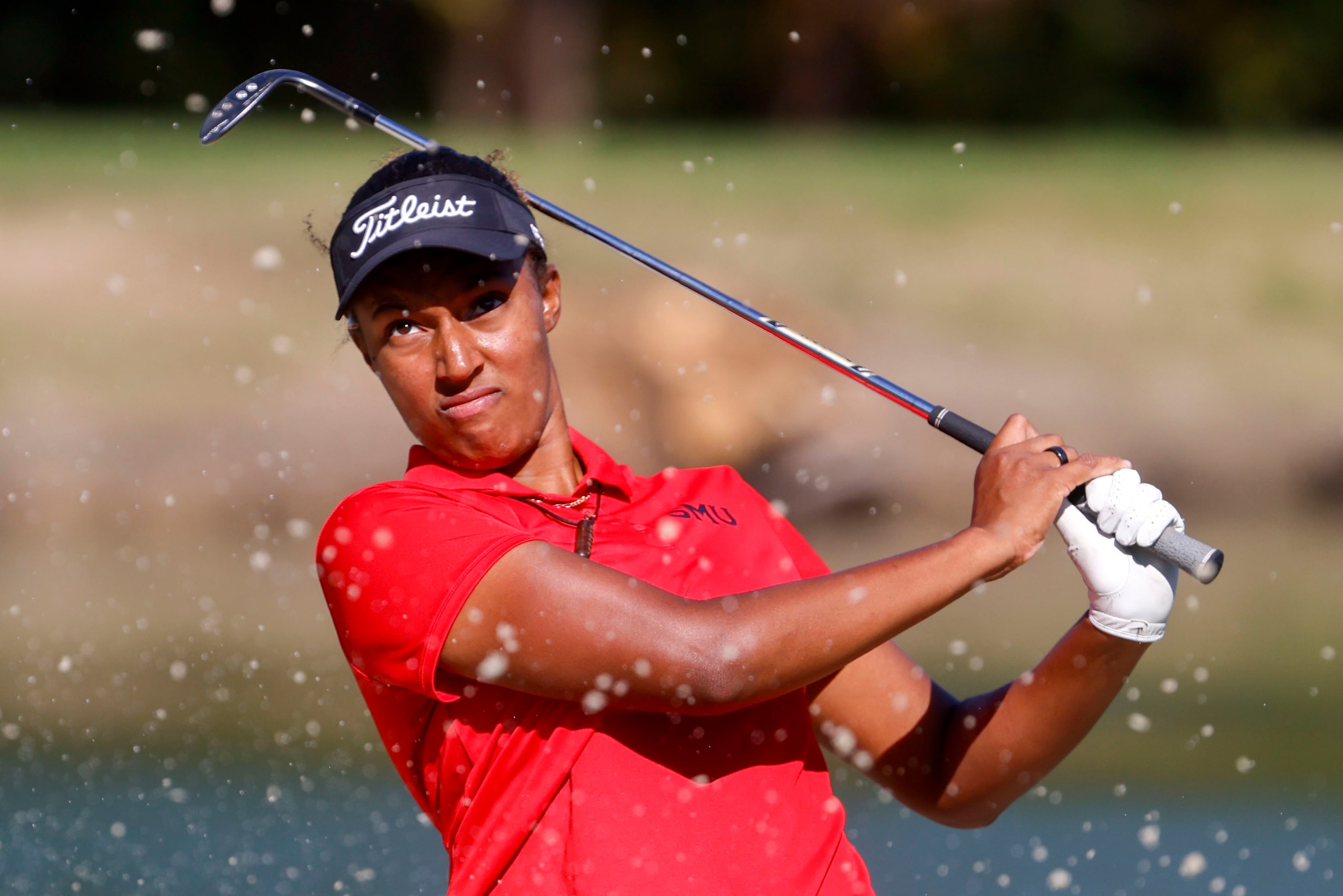 Emily Odwin of SMU hits out off a sand trap in the third hole during the Southwest Airlines...