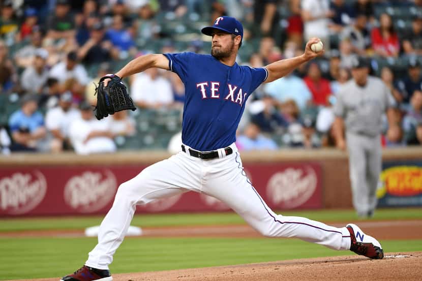 Texas Rangers starting pitcher Cole Hamels works against the New York Yankees during the...