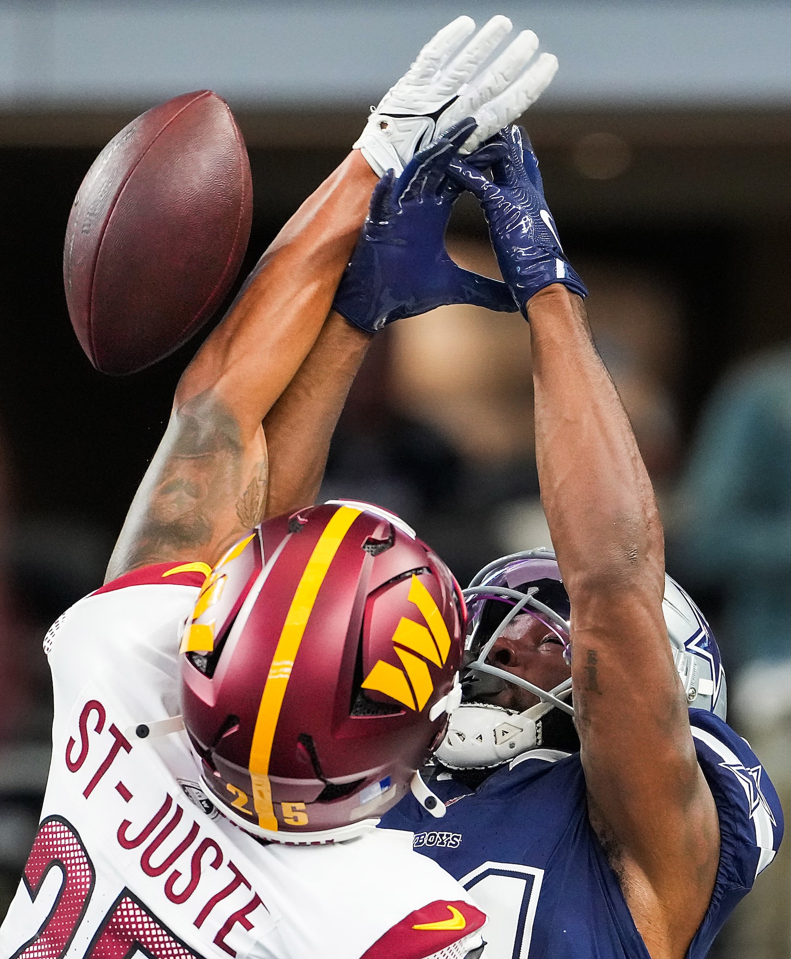 Washington Commanders cornerback Benjamin St-Juste (25) breaks up a pass intended for Dallas...