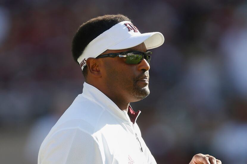 Texas A&M head coach Kevin Sumlin watches warmups before playing Ball State in an NCAA...