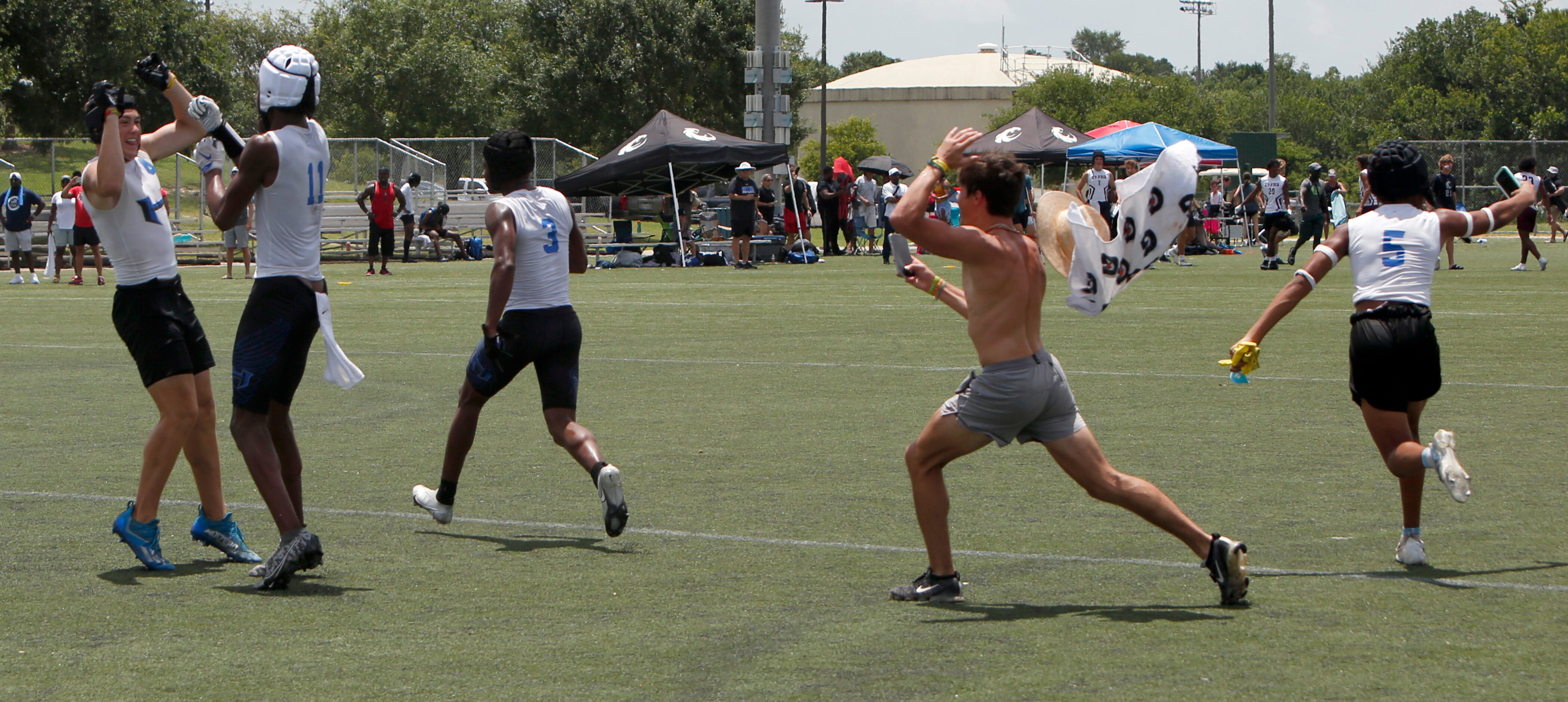 Hebron Hawks storm the field after defeating Lake Travis 28-26 in the championship Div.1...