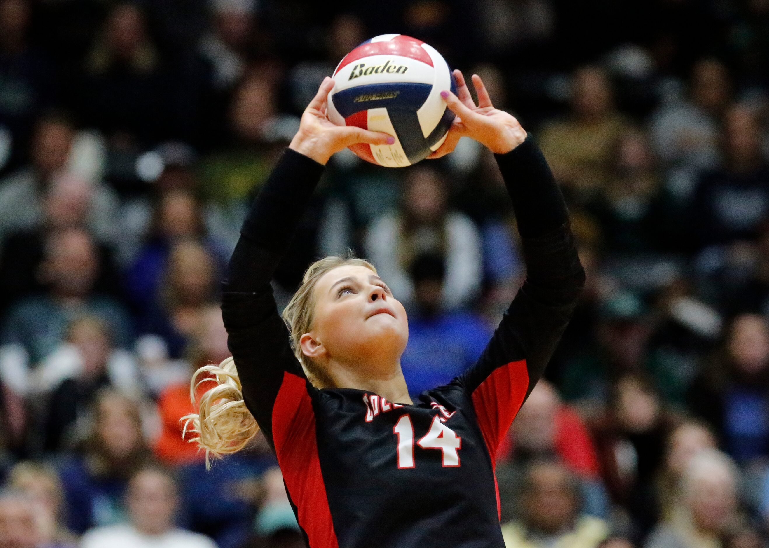 Colleyville Heritage High School setter Morgan Howard (14) makes a set during game three as...