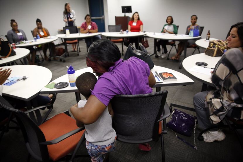 Antranette Canady hugs her 5-yr old grandson, Kwamane Dale during a Women's Independence...