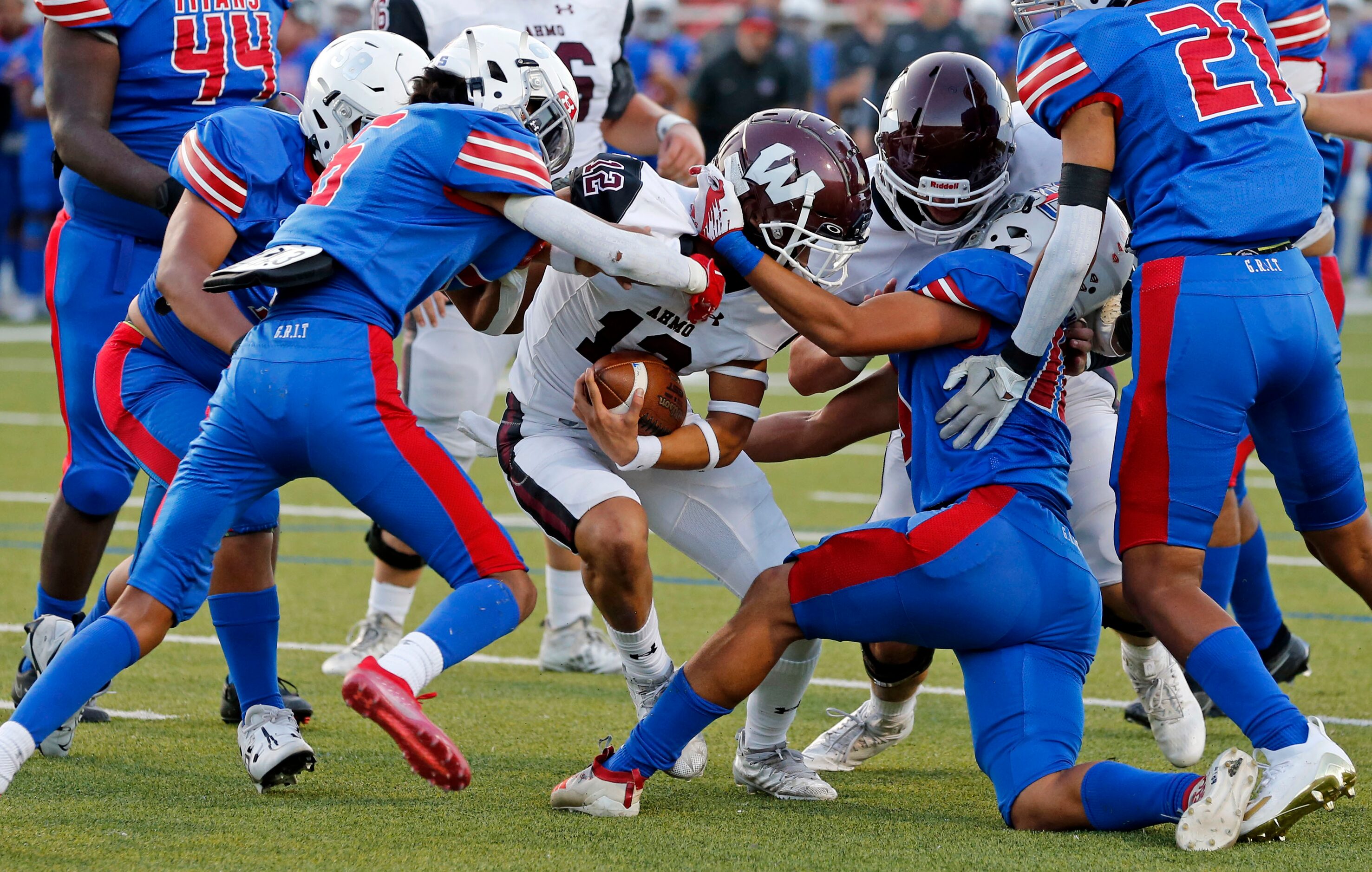 Wylie High QB Lance Crosby (12) gets to the one-yard-line despite being swarmed by a group...