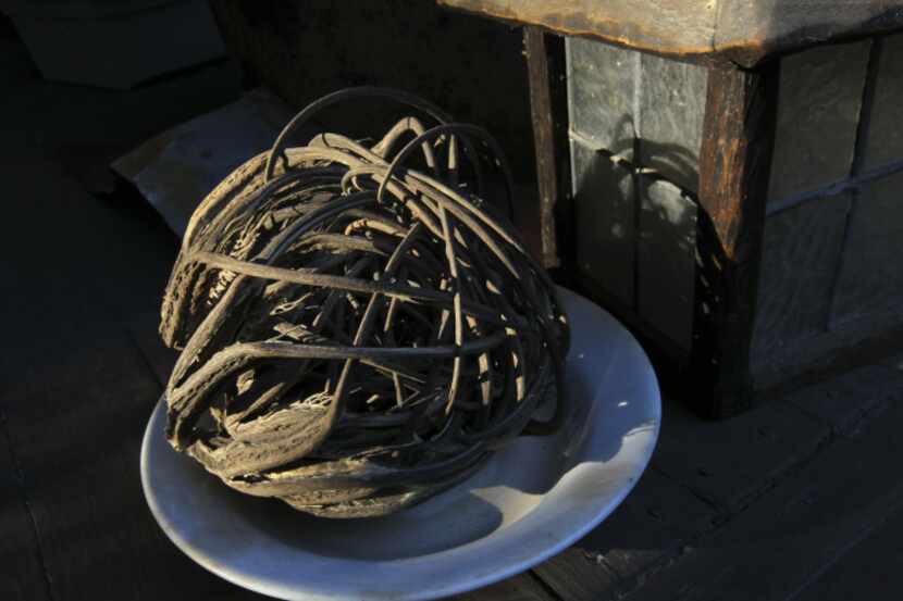 Hooked devil's claw seed pods are interwoven to form a tight sphere for easy storage,...