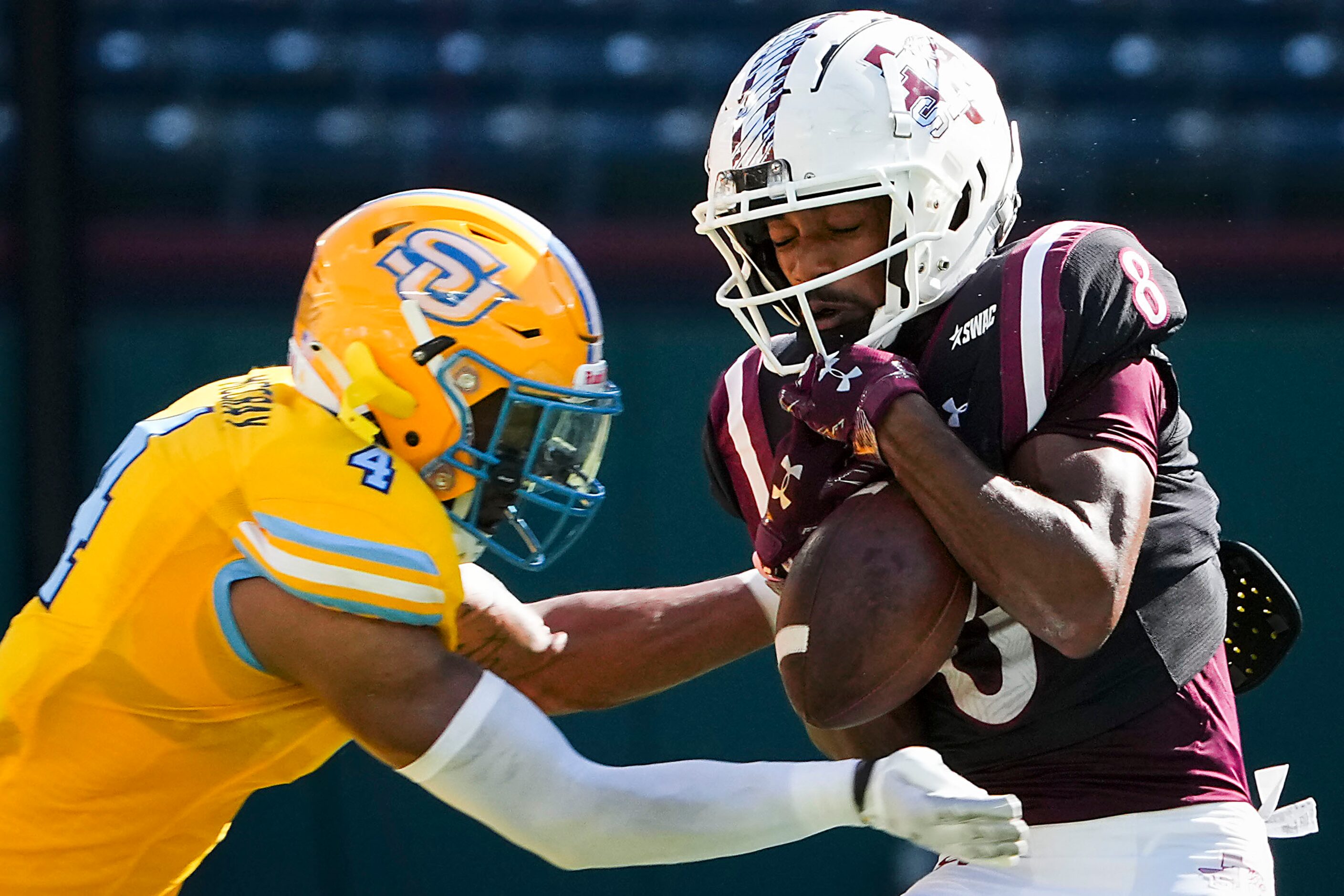 TSU wide receiver Derek Morton (8) catches a pass as Southern defensive back Benny McCray...