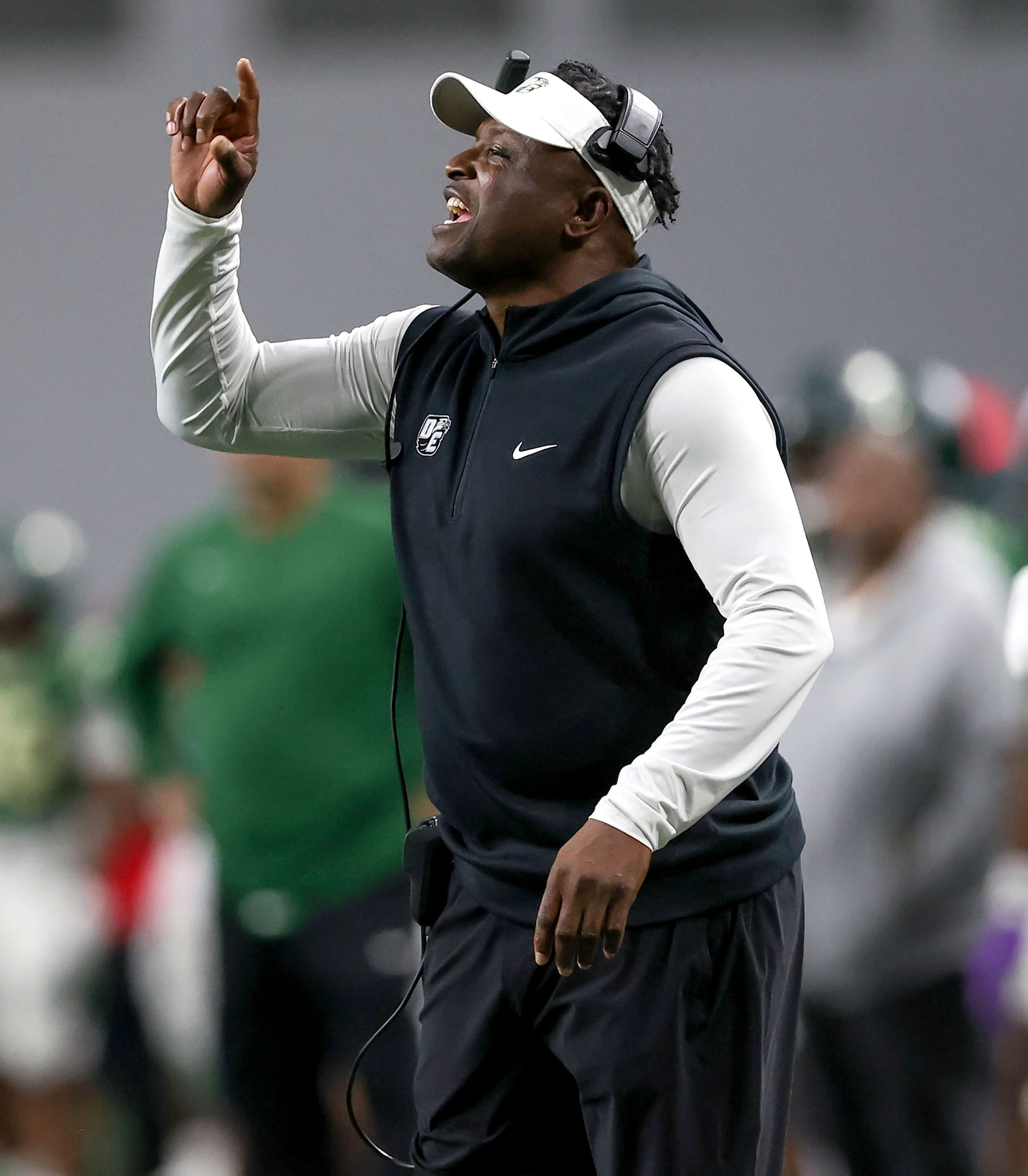 DeSoto head coach Claude Mathis instructs his players against Willis during the first half...