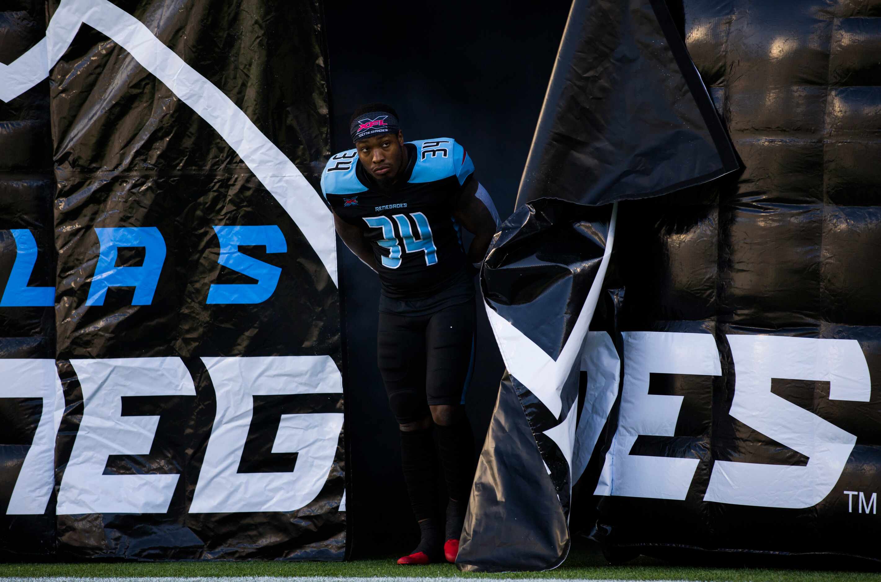 Dallas Renegades running back Cameron Artis-Payne (34) looks for permission to run on the...