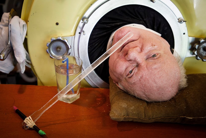 Paul Alexander looks out from inside his iron lung at his home in Dallas.  Now in his 70s,...