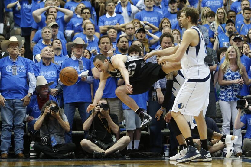 San Antonio Spurs guard Manu Ginobili (20) is fouled with less than a minute to go by Dallas...