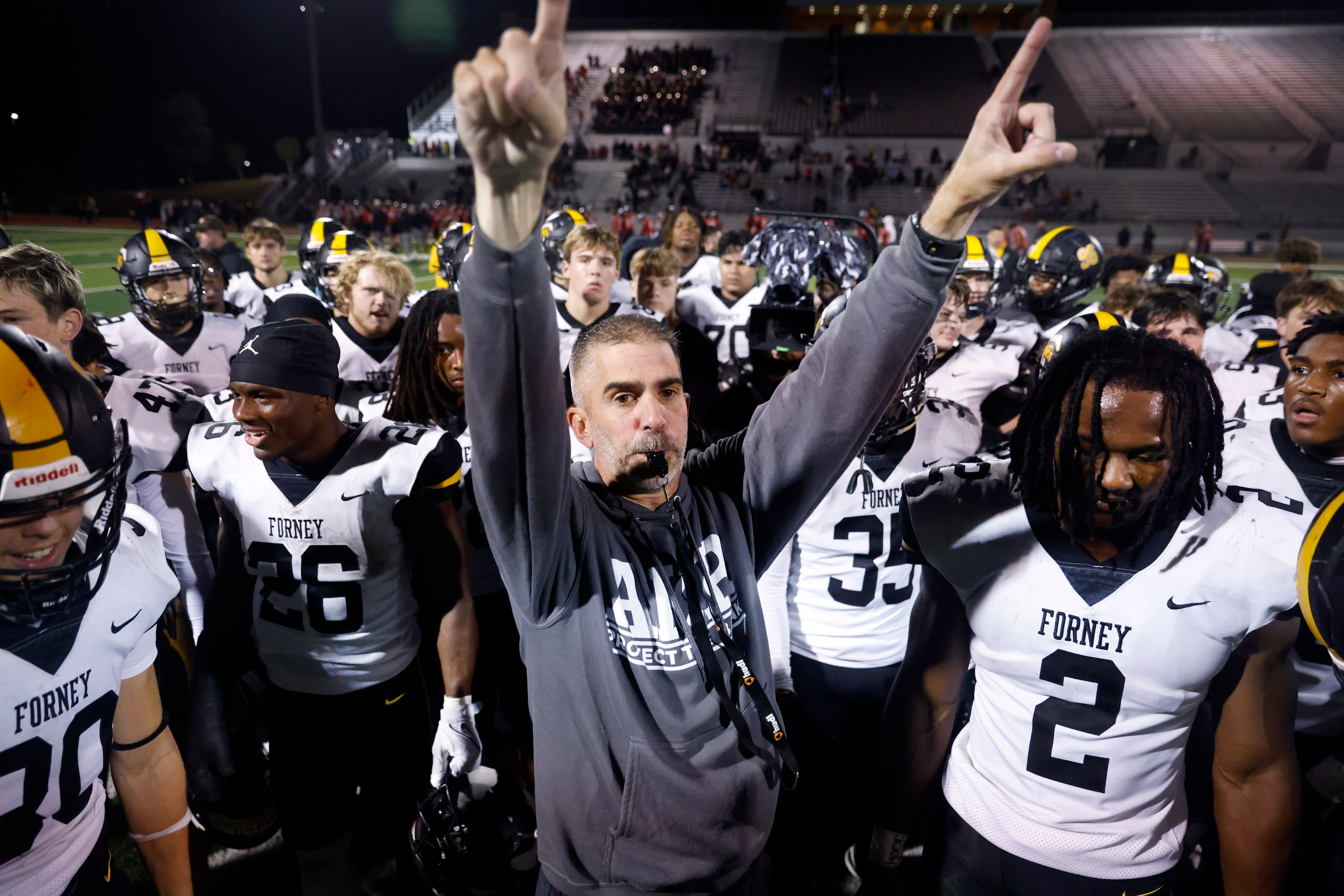 Forney head football coach Jeff Fleener reminds his players to go thank their family and...