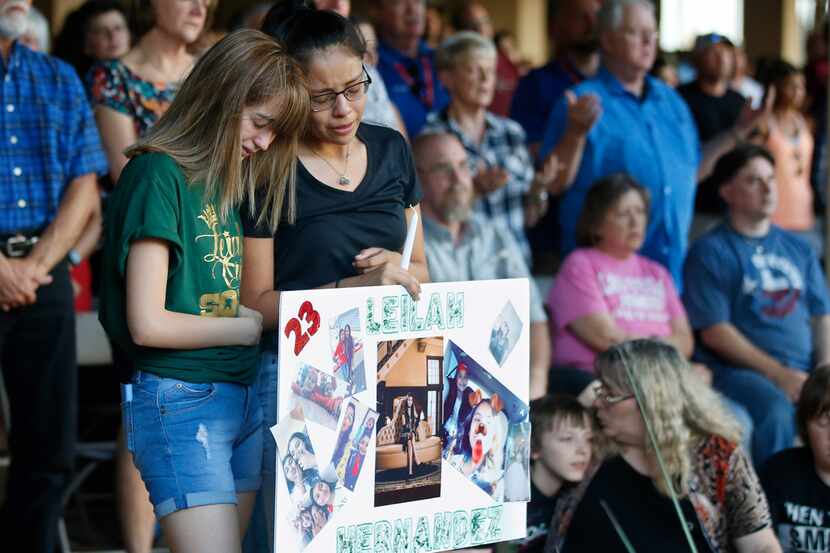 At a memorial service Sept. 1 in Odessa, high school students Celeste Lujan (left) and...