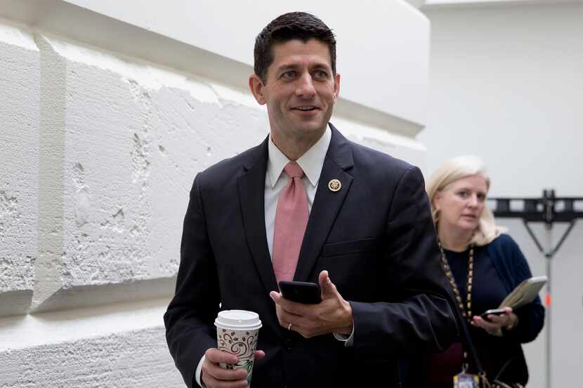 Rep. Paul Ryan, R-Wis., walks from a House GOP candidate forum on Capitol Hill in...
