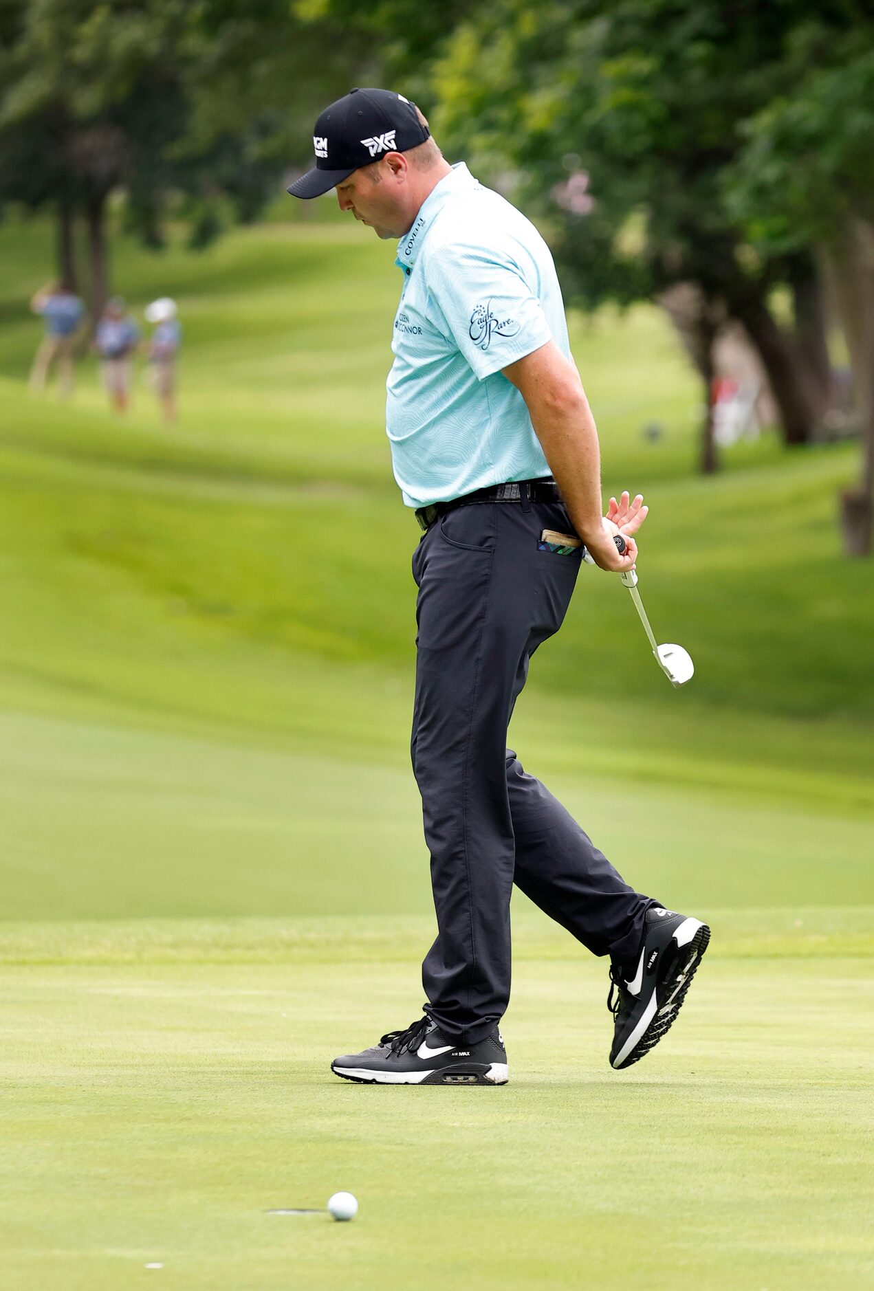 Professional golfer Jason Kokrak reacts after missing a birdie putt on No. 5 during round...