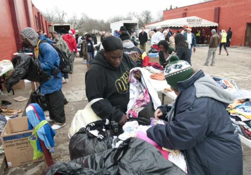 Guests looked through donated clothing at BigHeart Ministries' Christmas celebration, a...