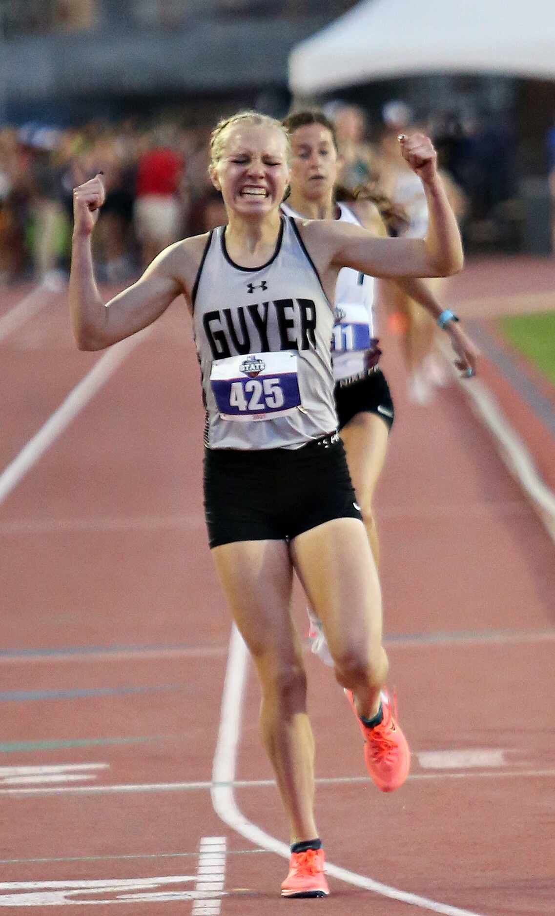 Denton Guyer's Brynn Brown reacts after crossing the finish line in first place in the 6A...