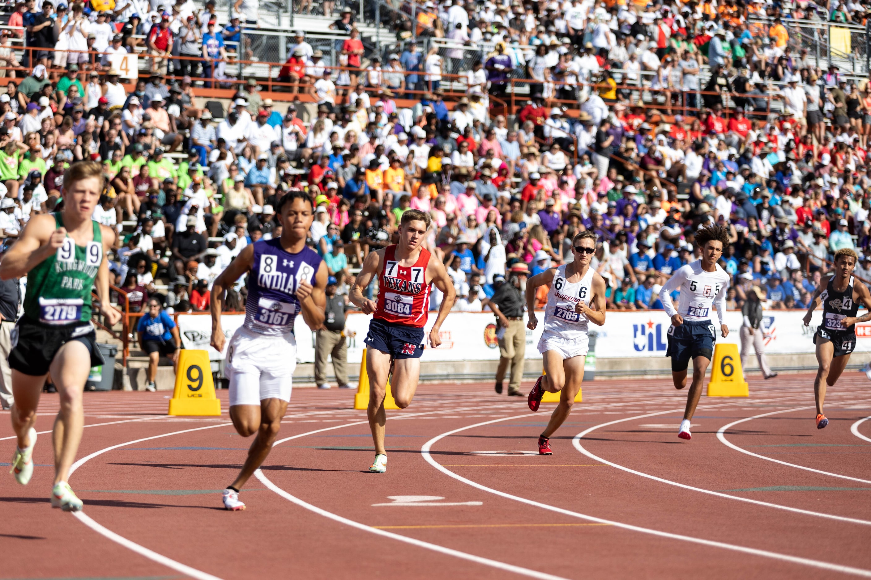 Andrew Lutkenhaus of Northwest and Walker St. John of Grapevine race in lanes 7 and 6 of the...