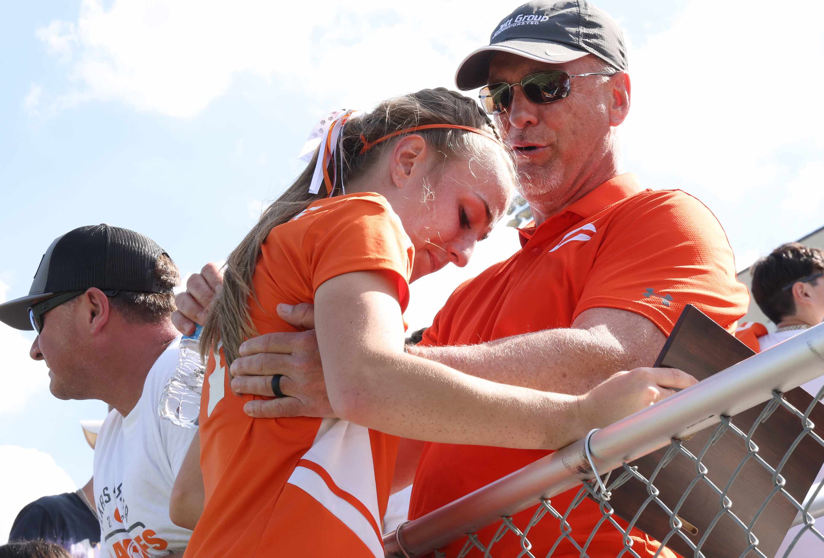 Celina's Lexi Tuite (7) hugs her dad in the stands following a record setting five goals to...