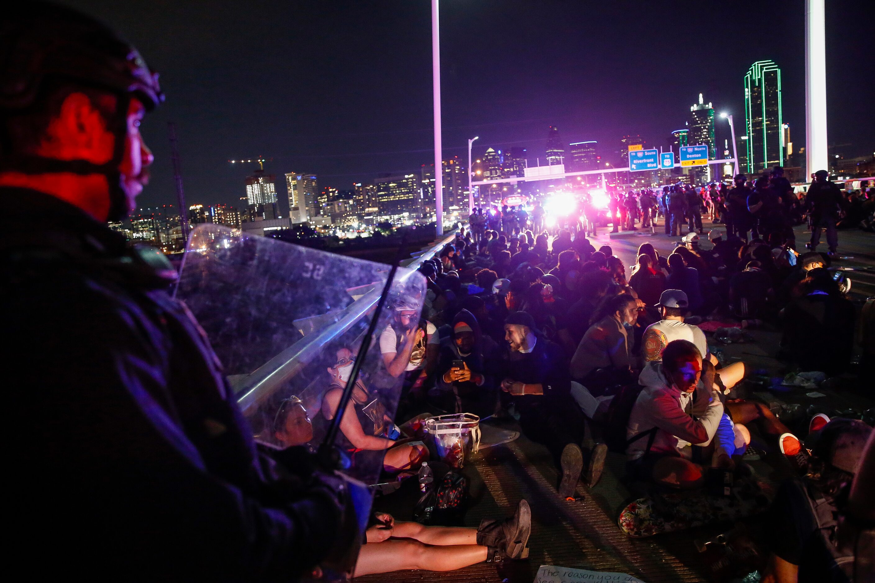 Police surround and detain hundreds of protesters who marched onto the Margaret Hunt Hill...