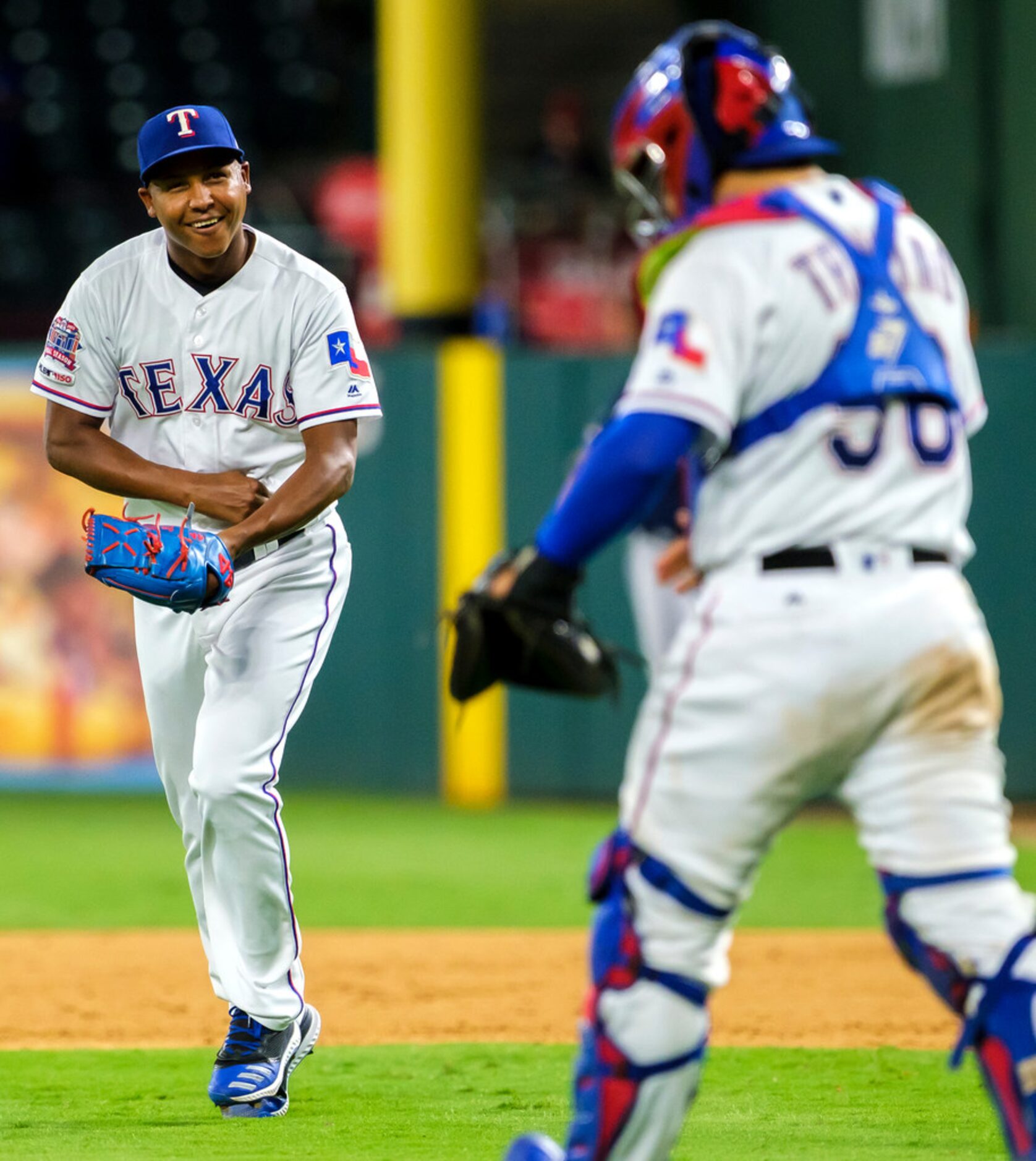 Texas Rangers relief pitcher Jose Leclerc celebrates with catcher Jose Trevino after...