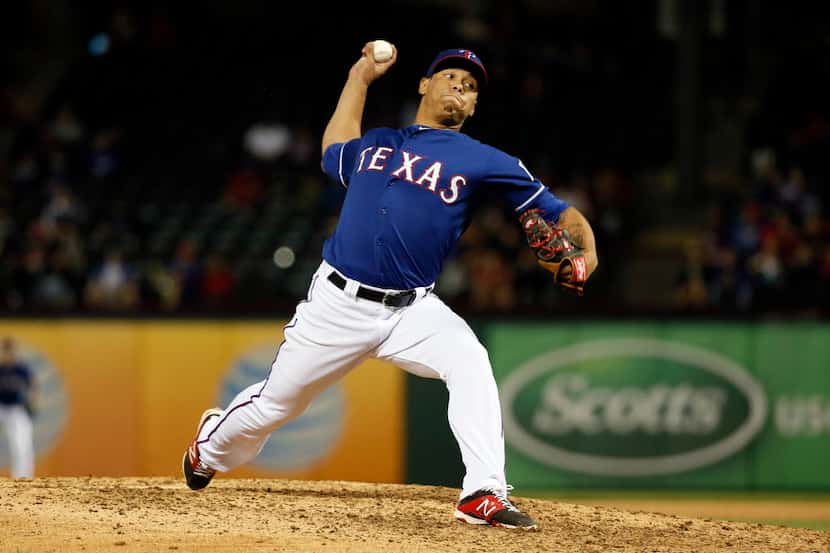 Texas Rangers' Keone Kela works against the New York Mets during an exhibition baseball game...