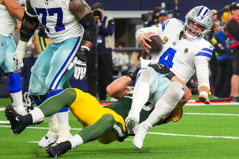 Dallas Cowboys quarterback Dak Prescott (4) is sacked by Green Bay Packers linebacker Lukas...