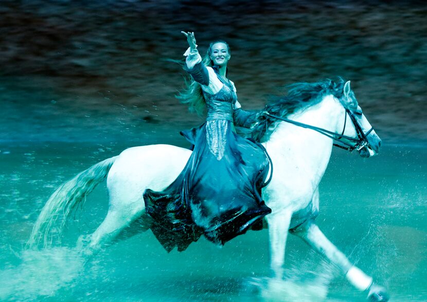 Elise Verdoncq (cq) performs during a preview of Cavalia's production Odysseo in Frisco,...