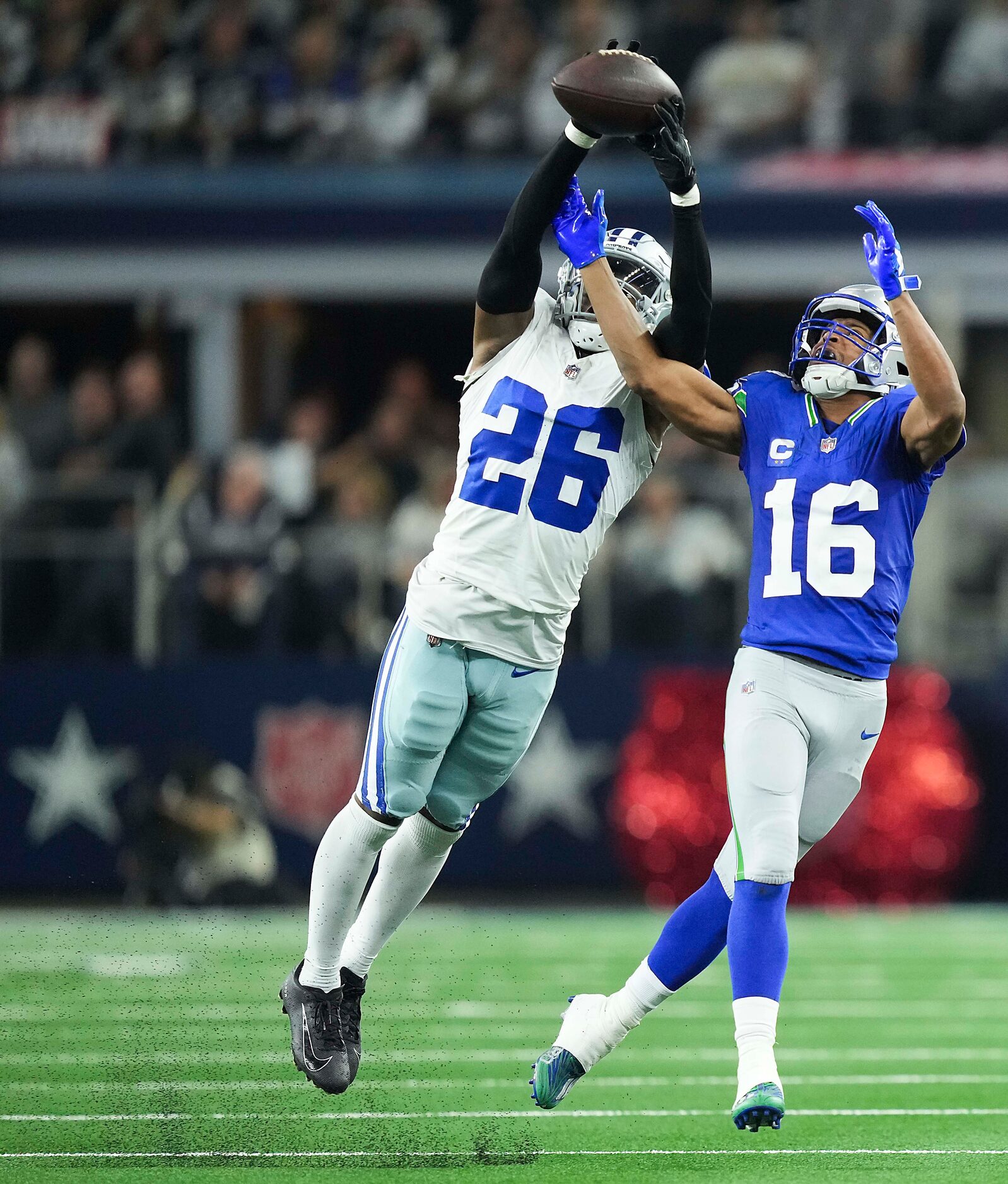 Dallas Cowboys cornerback DaRon Bland (26) intercepts a pass intended for Seattle Seahawks...