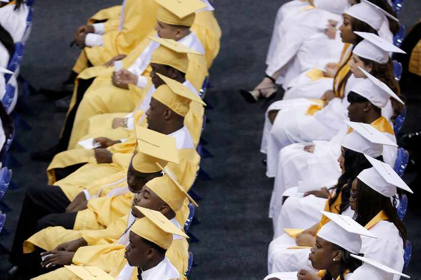 Students at South Oak Cliff High School waited to receive their diplomas during a graduation...