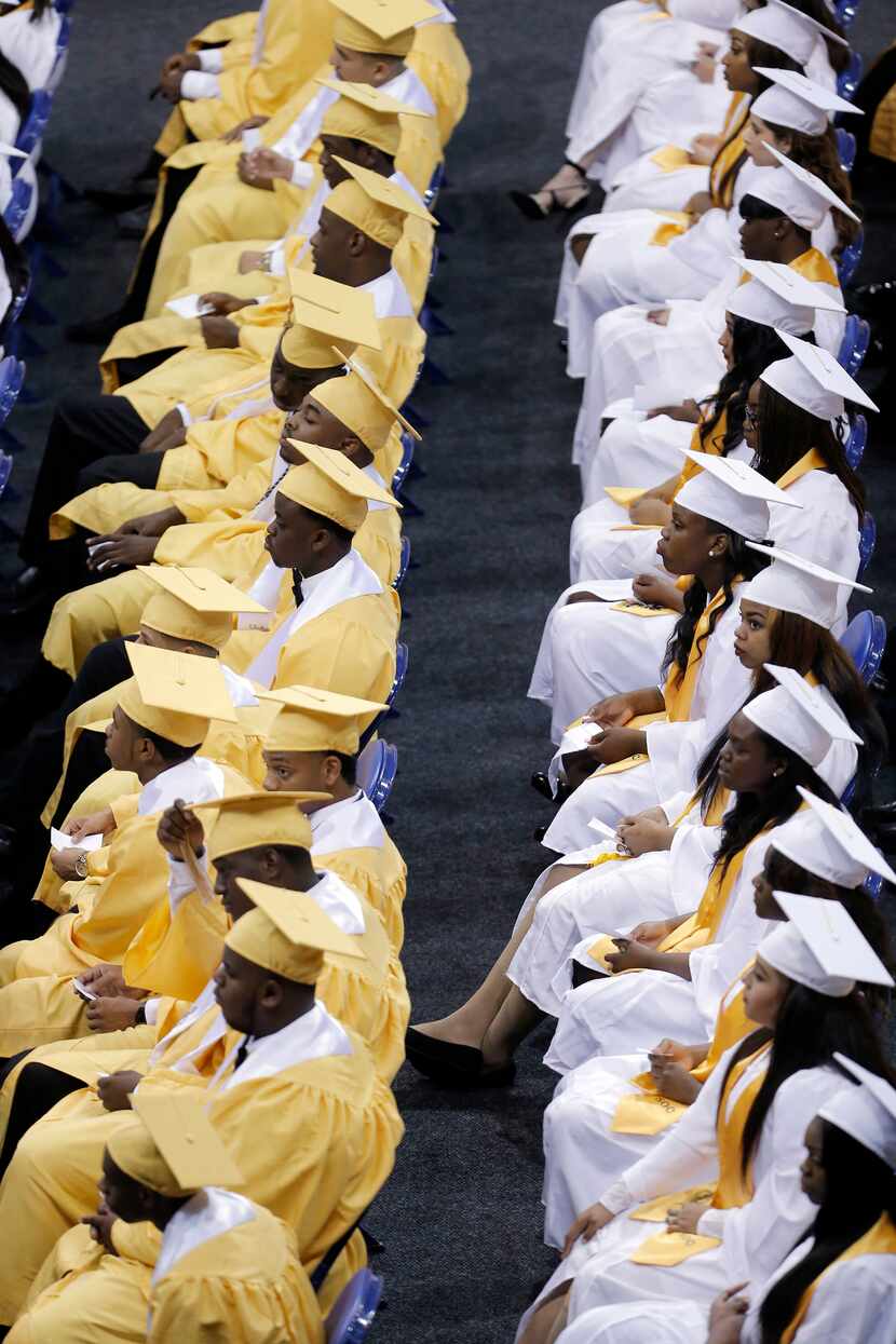 Students at South Oak Cliff High School waited to receive their diplomas during a graduation...