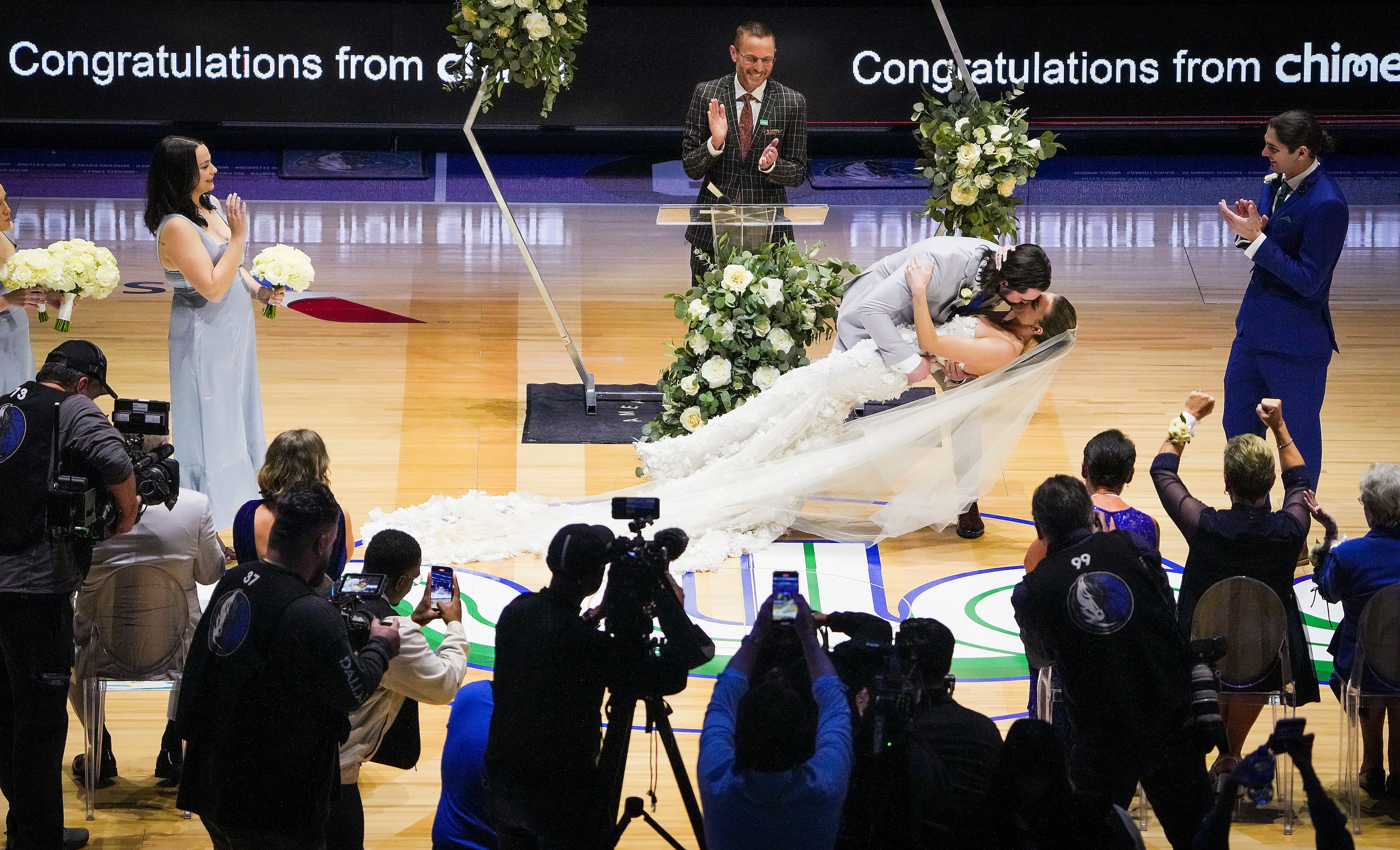 Reid Malone marries Ellyn Nichole Piatt at center court during halftime of an NBA basketball...