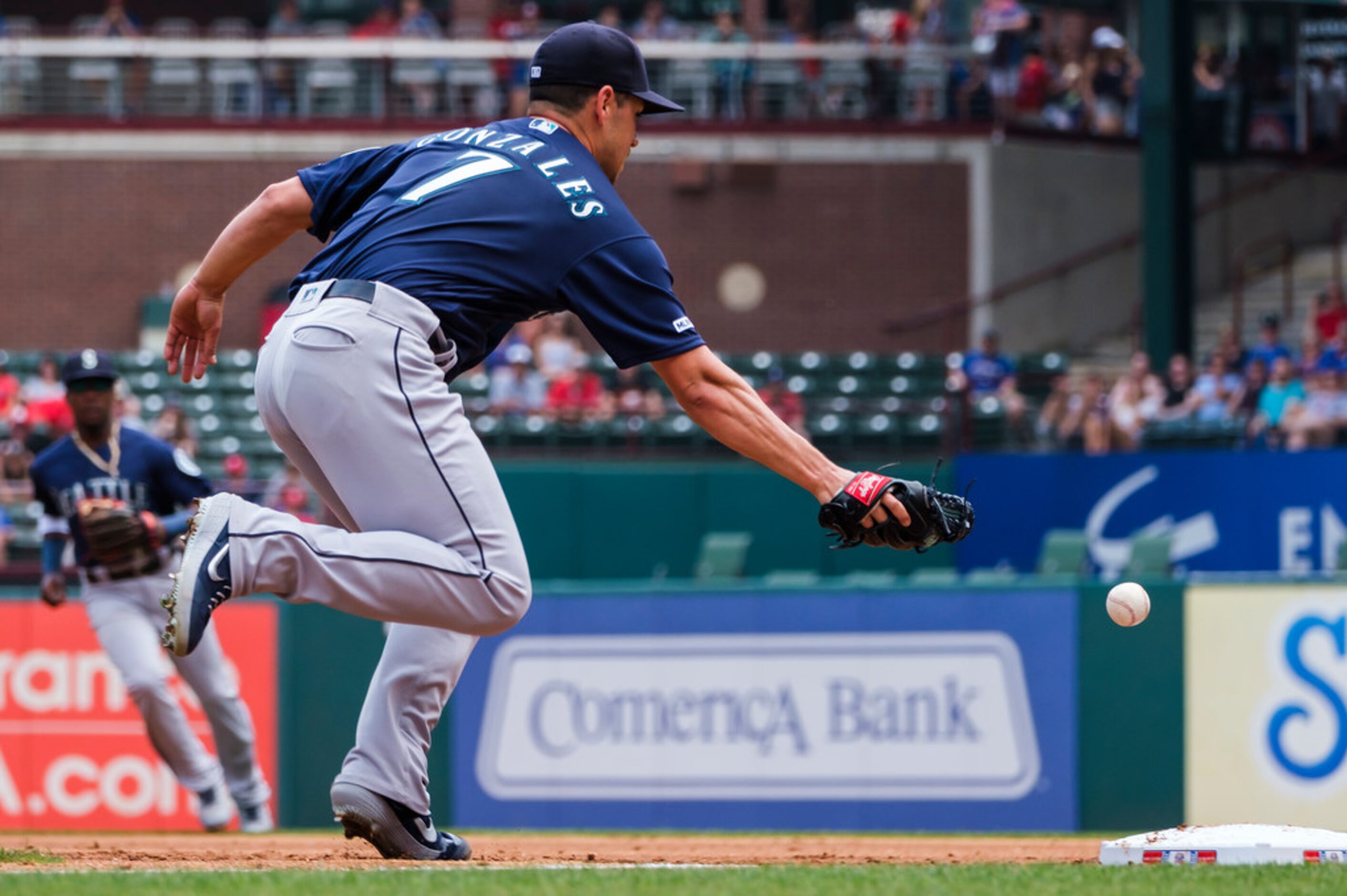 Seattle Mariners starting pitcher Marco Gonzales canÃt make the play on a throwing error by...