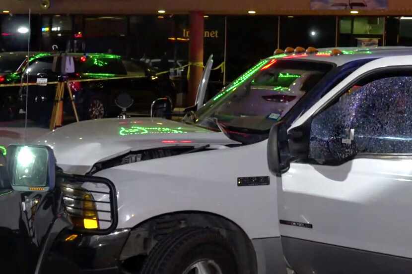 A wrecked pickup truck with a shattered drivers side window after Farmers Branch police...