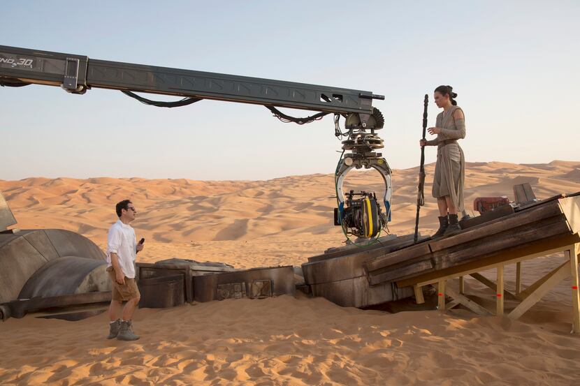 Director J.J. Abrams with actress Daisy Ridley (Rey) on set