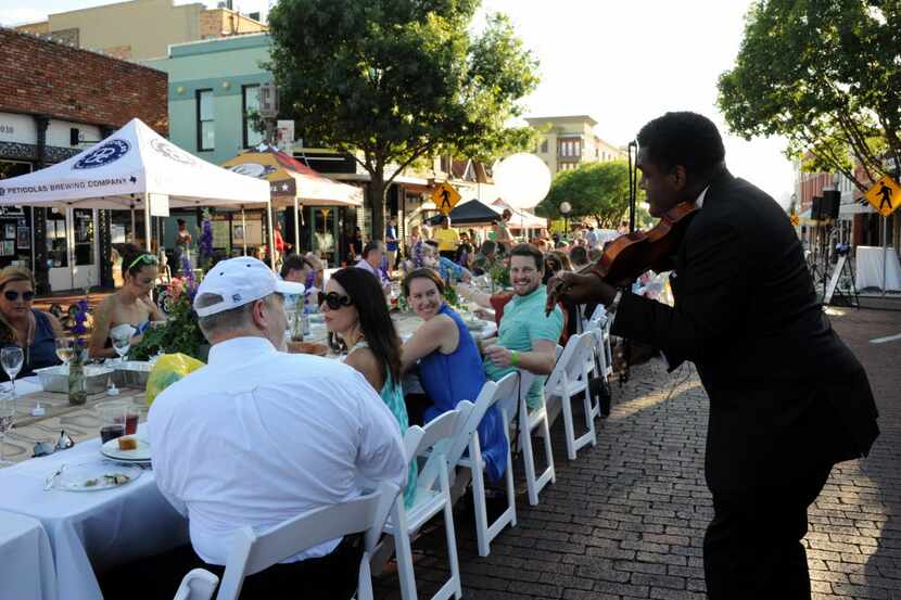 Richmond Punch entertains guests at Night Out on 15th Street in downtown Plano, TX on June...