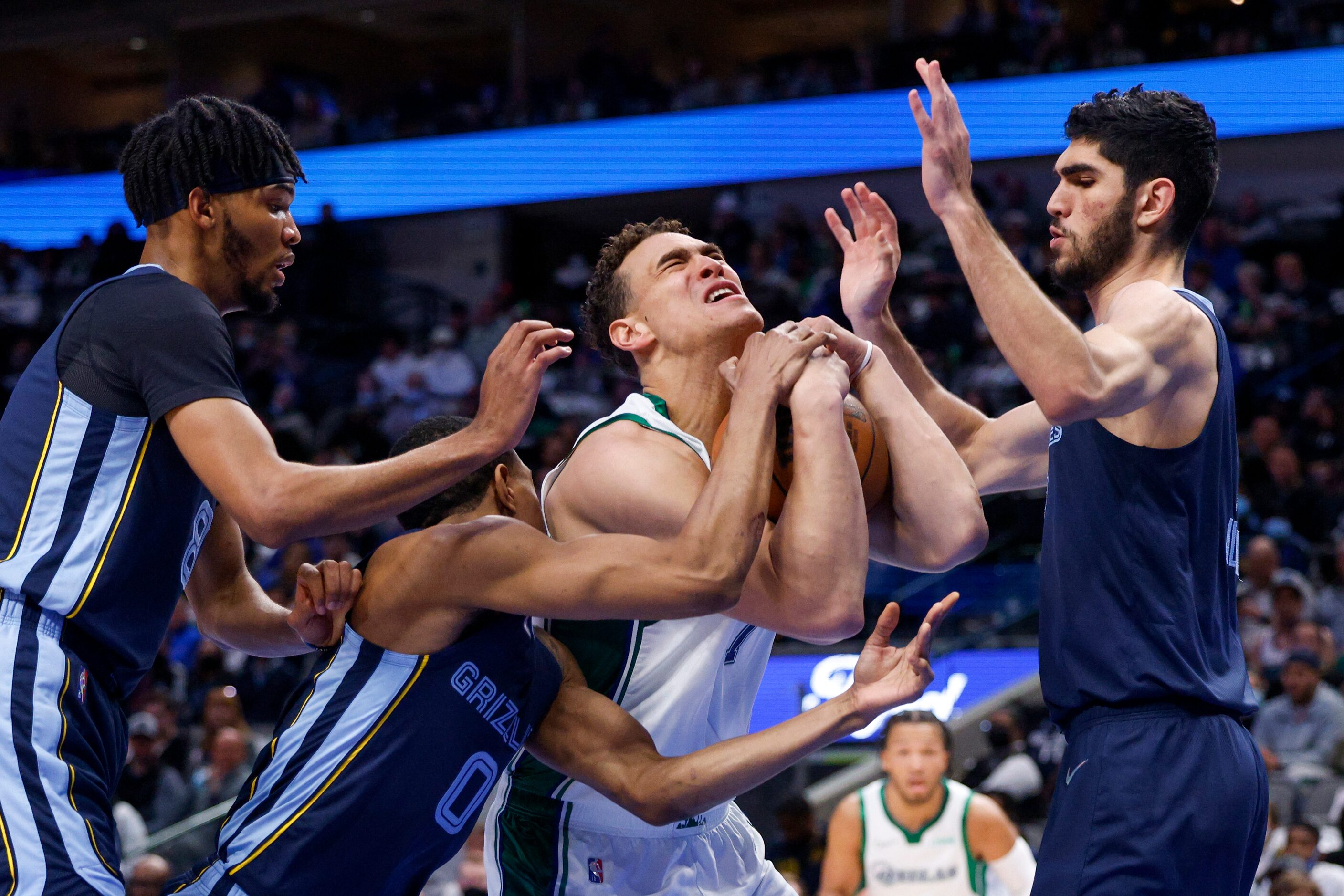 Memphis Grizzlies guard De'Anthony Melton (0) fouls Dallas Mavericks center Dwight Powell...