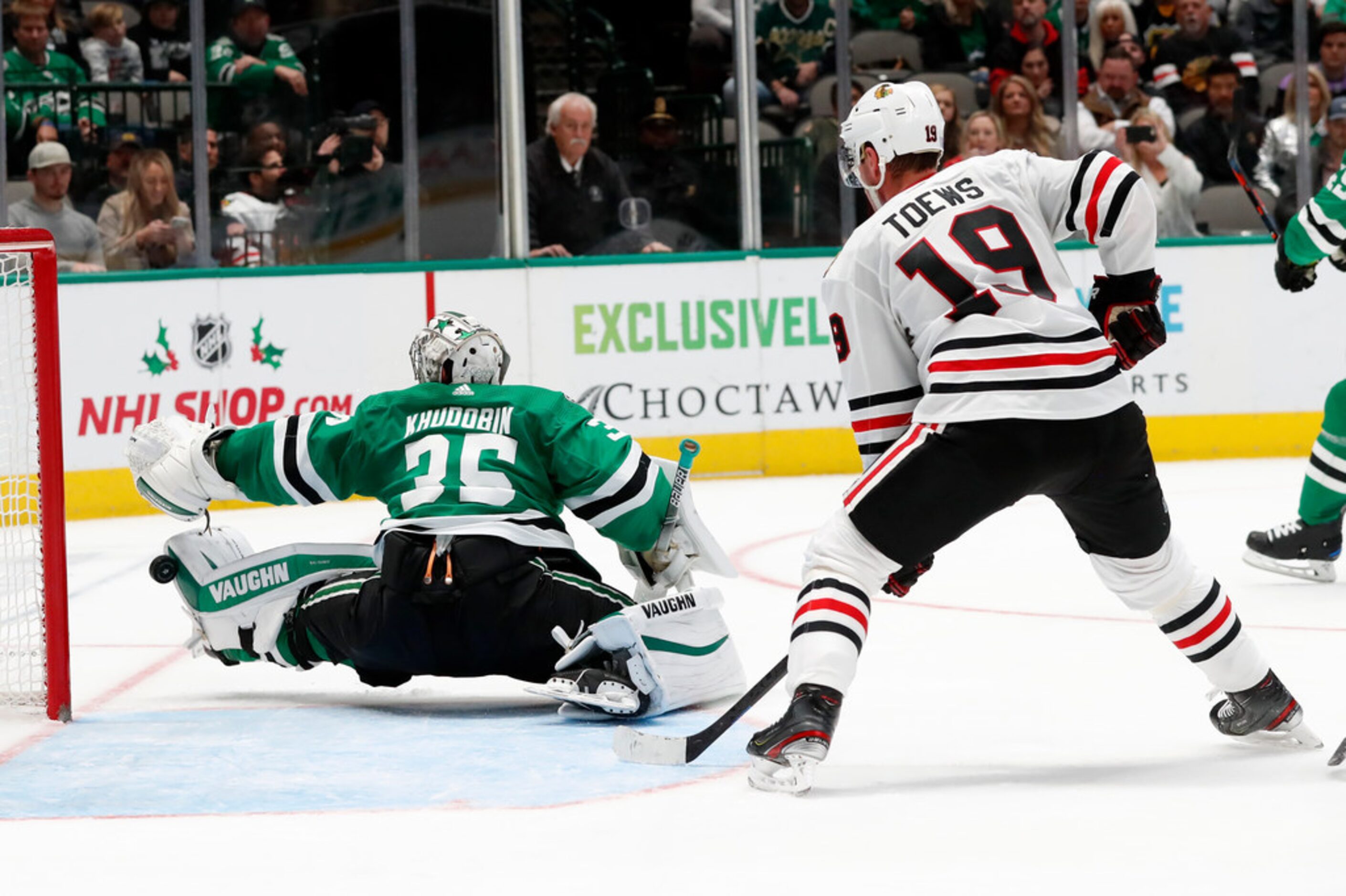 Dallas Stars goaltender Anton Khudobin (35) blocks a shot as Chicago Blackhawks center...