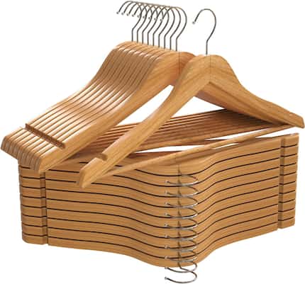 Stack of wooden hangers on a white background