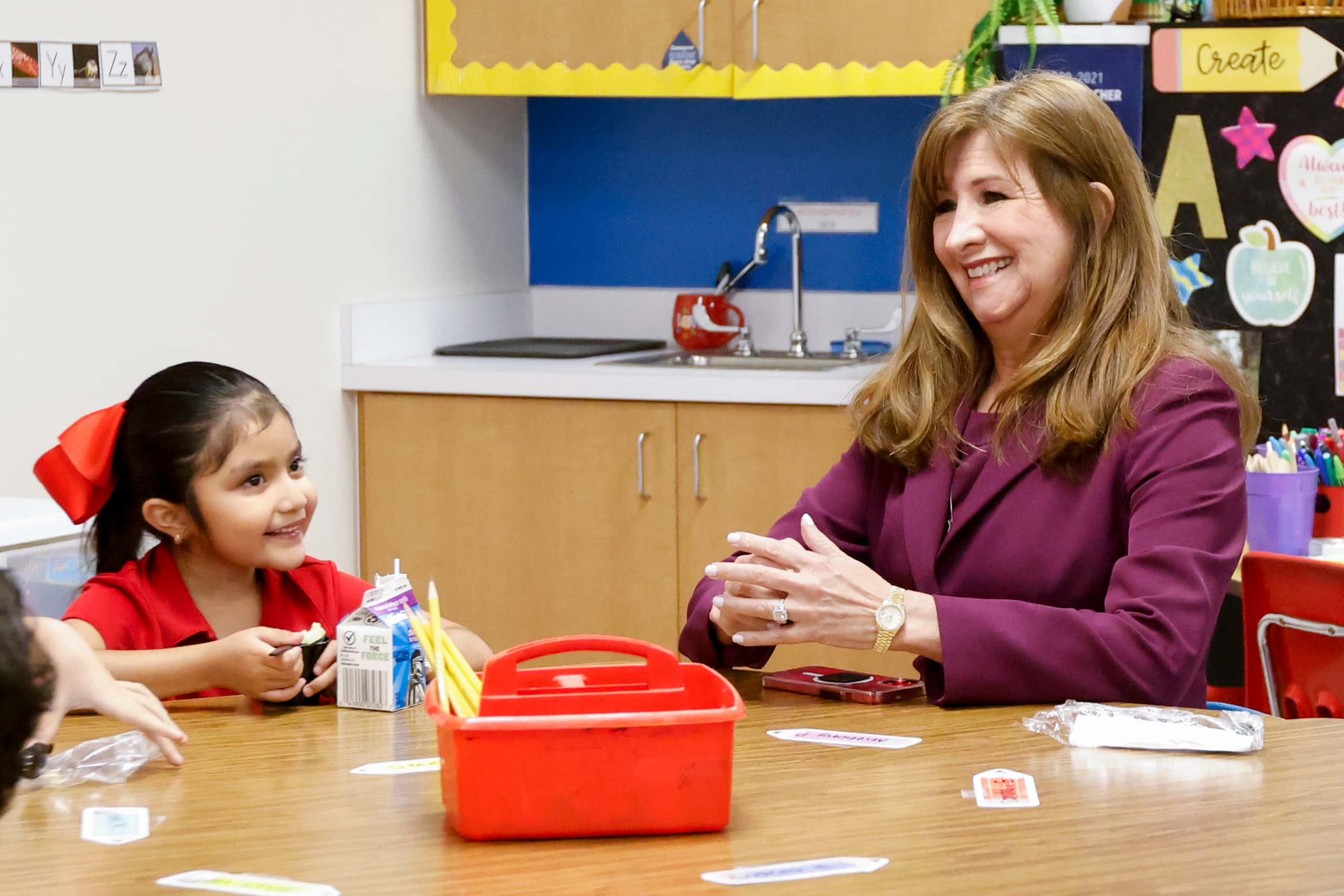 Dallas ISD superintendent Stephanie Elizalde talks with Victoria Orta, 6, as she visits...