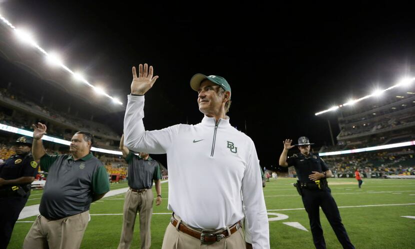 Baylor head coach Art Briles gestures as the school's song is played after an NCAA college...
