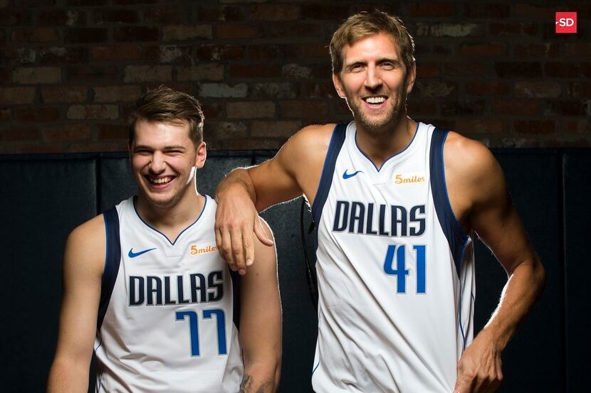 FILE - Mavericks players Luka Doncic (left) and Dirk Nowitzki poses for a photo during...