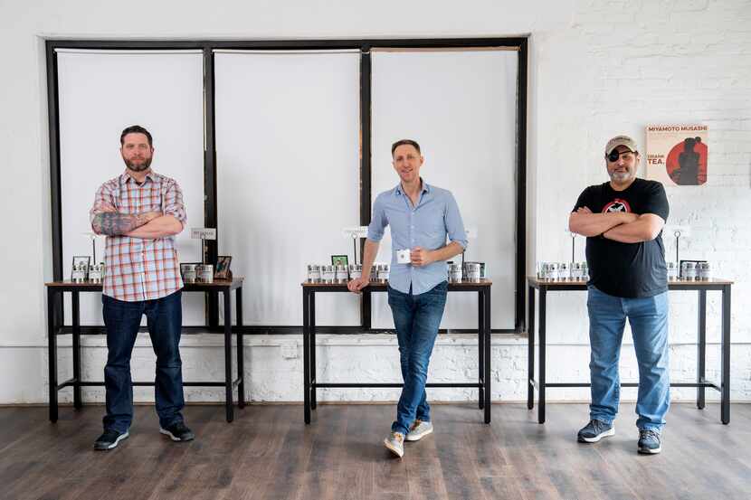 TK Kamauf, Brandon Friedman and Lance John, left to right, pose for portraits inside their...