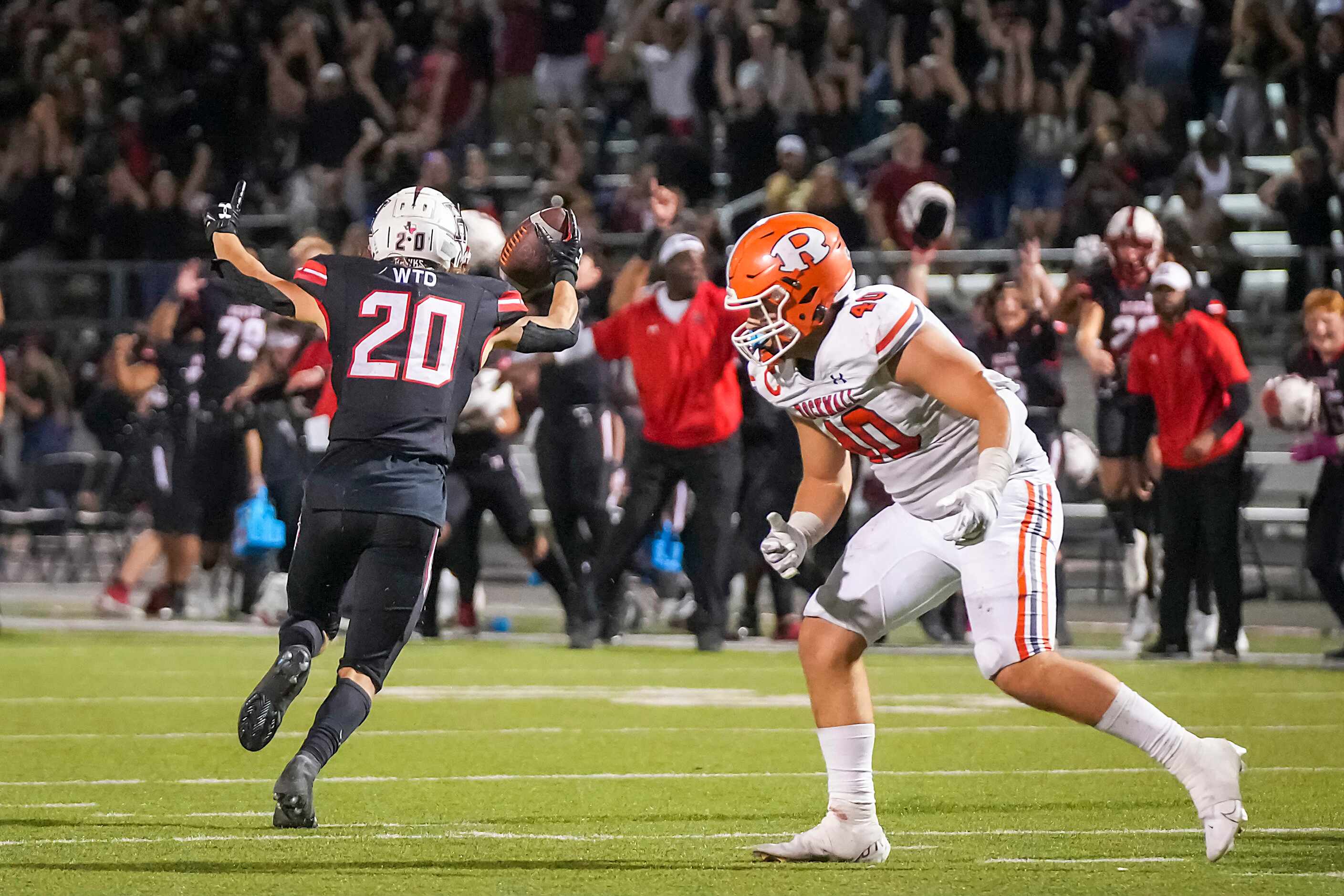 Rockwall-Heath defensive back Layne Horak (20) celebrates after intercepting a pass intended...