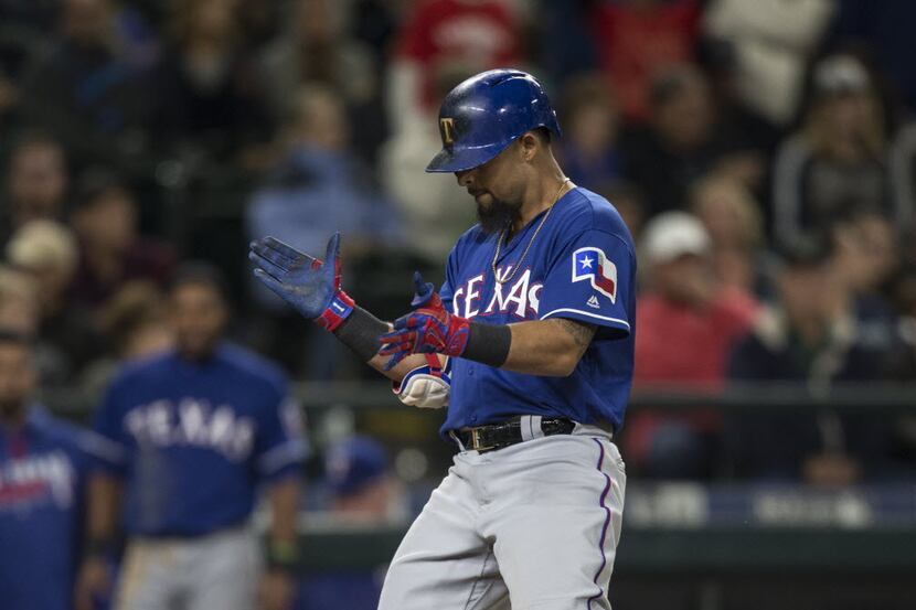 SEATTLE, WA - JUNE 11: Rougned Odor #12 of the Texas Rangers celebrates hitting a solo home...
