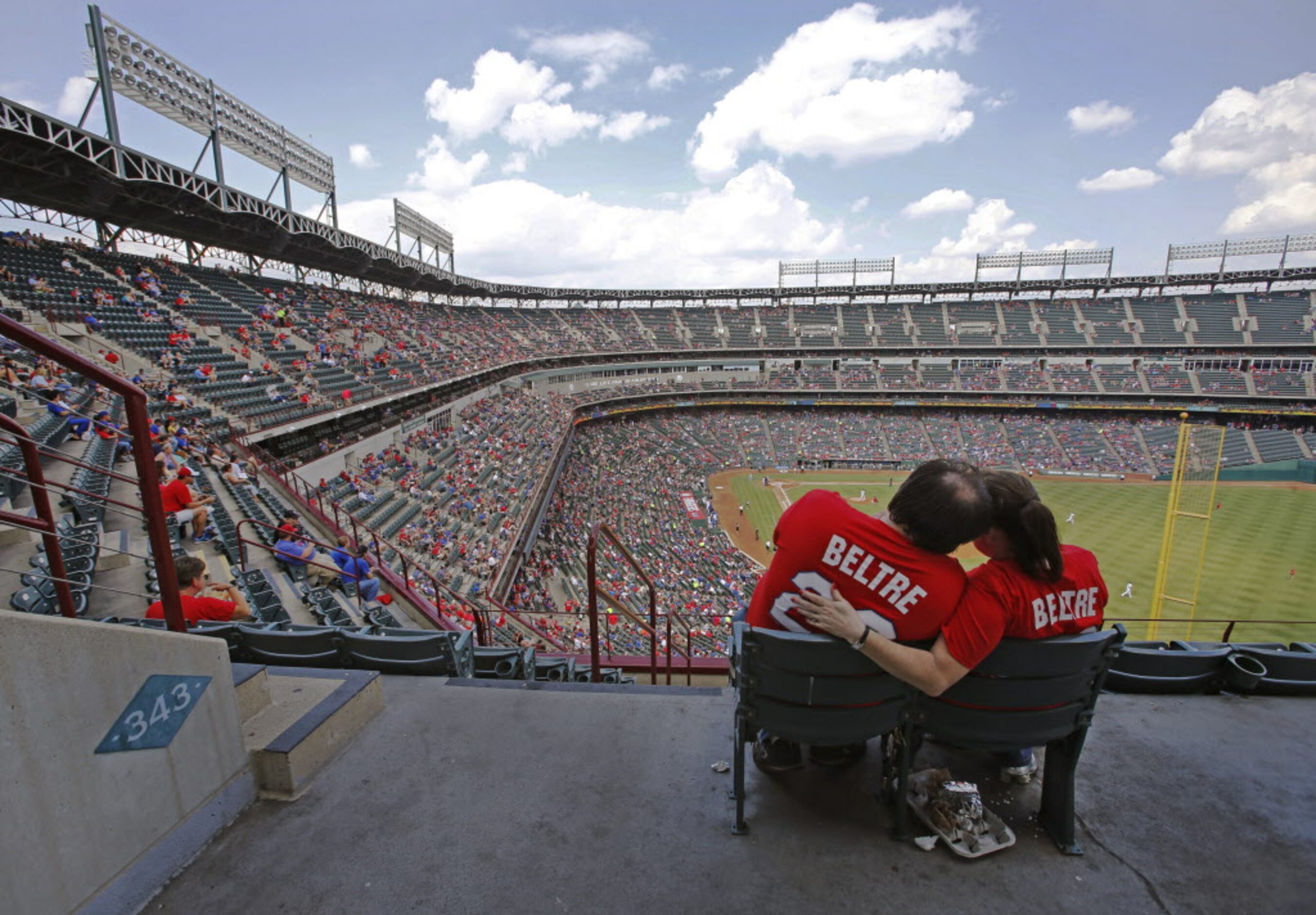 Rangers fans Jesse and Brenda Owens from Grand Prairie enjoy the game from the right field...