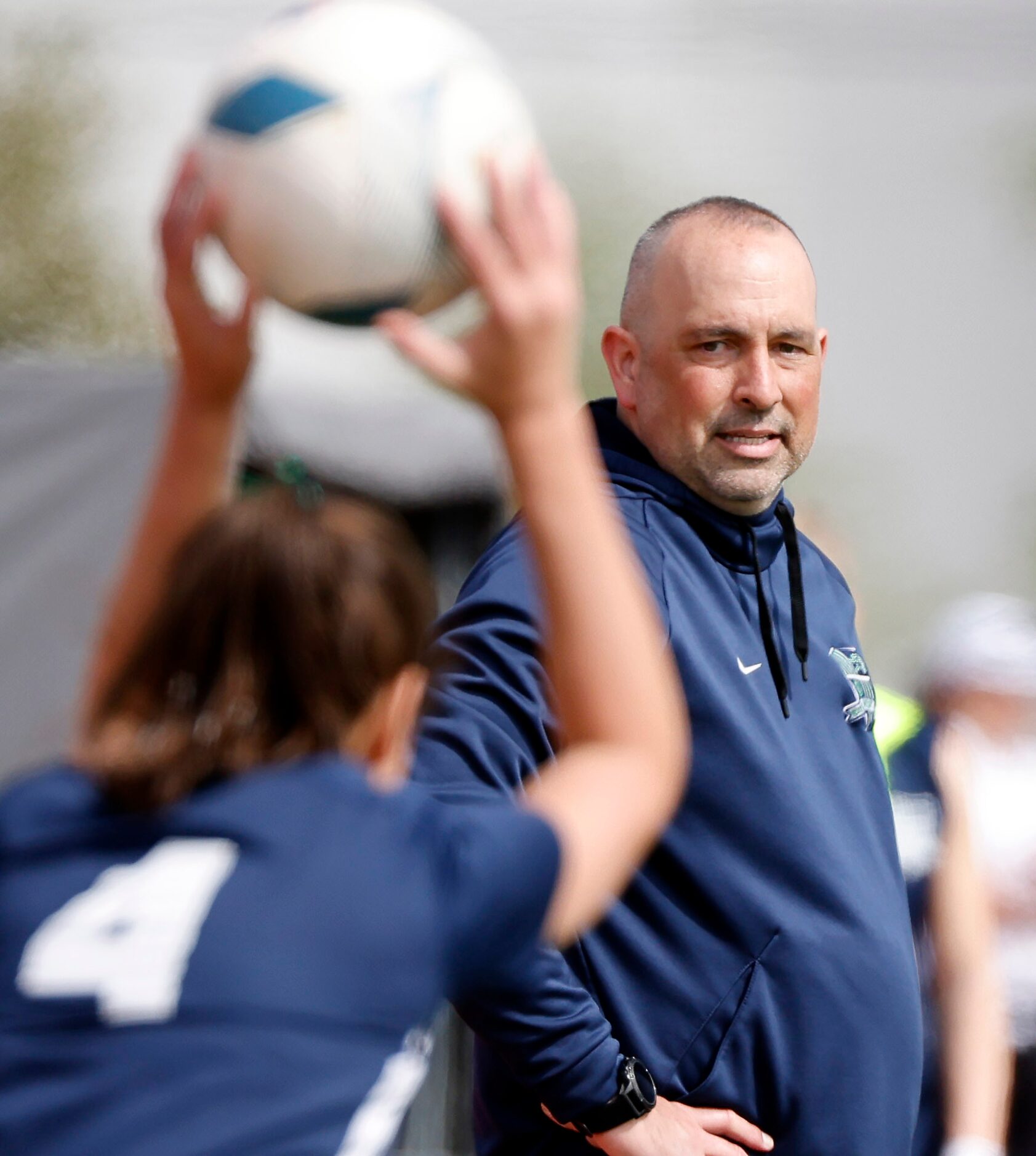 Frisco Reedy head coach Michael Khoury watches as Naia Rentschler (4) throws the ball in...